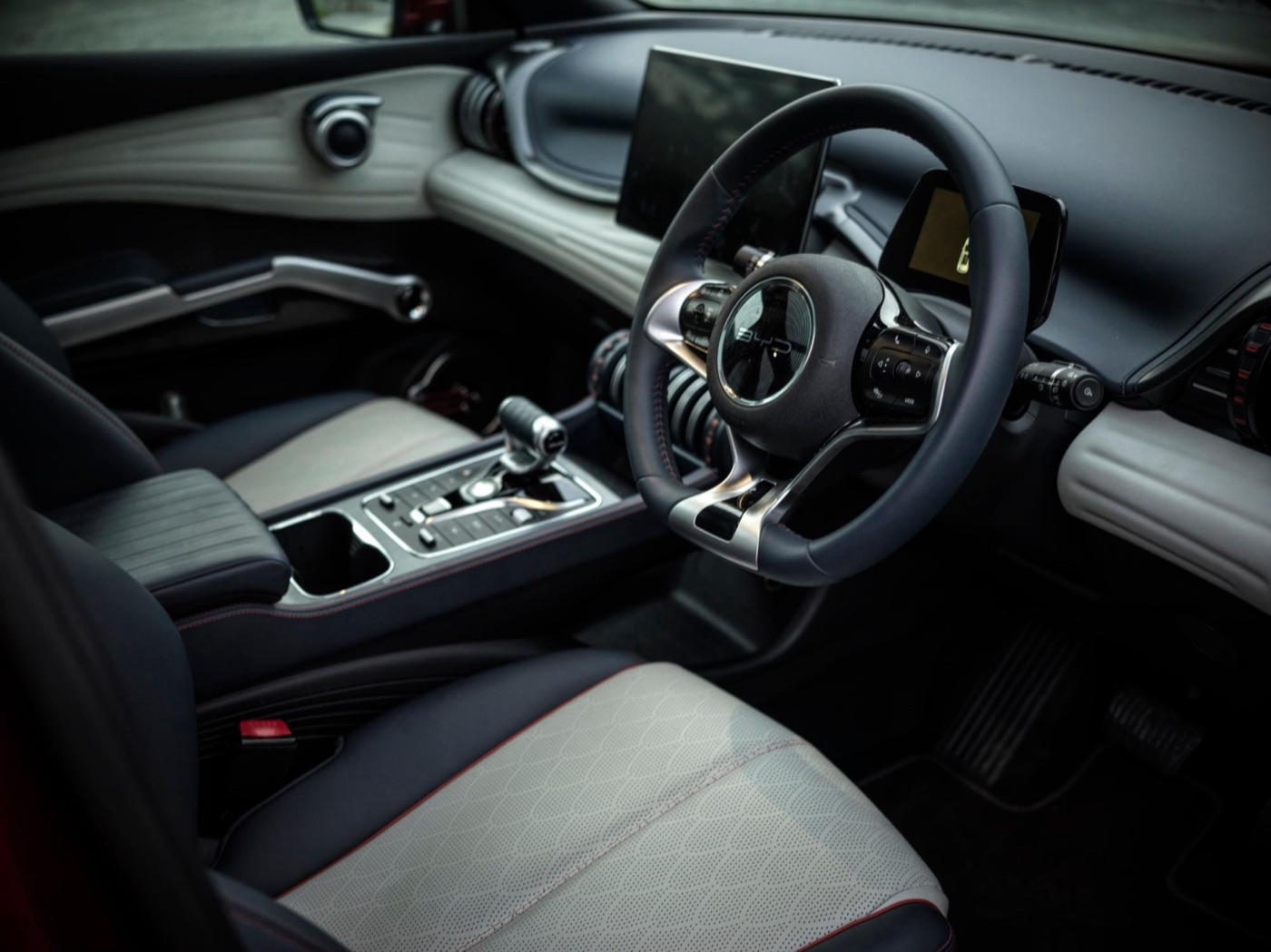 The driver’s seat, dominated by a big display.