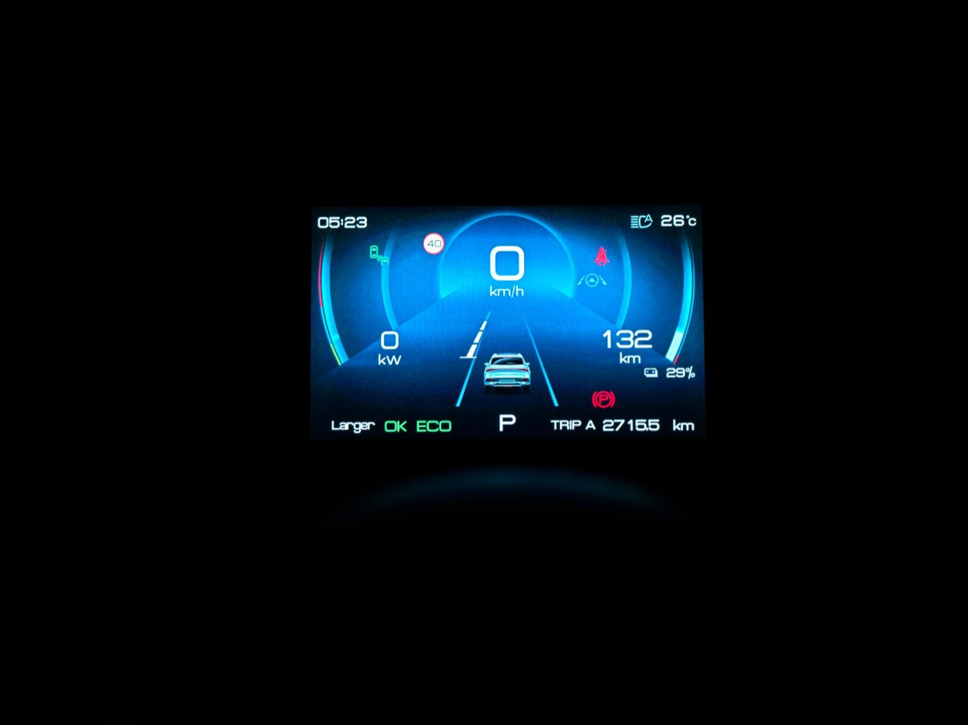 The gauge cluster showing speed, battery level, and more.