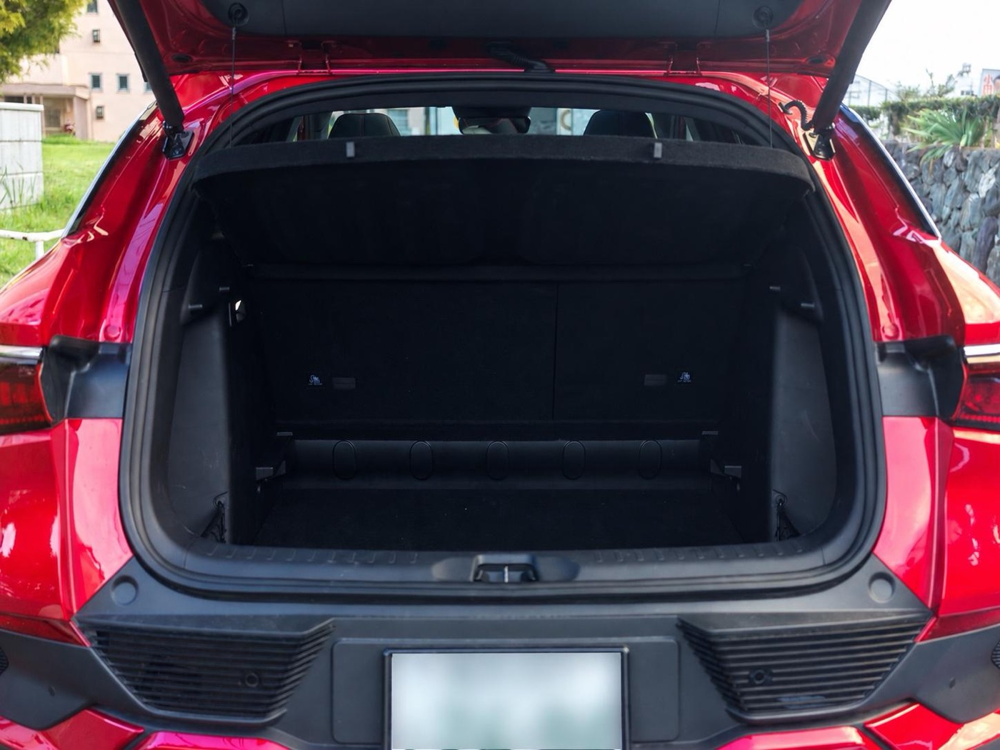 The trunk with the tailgate open.